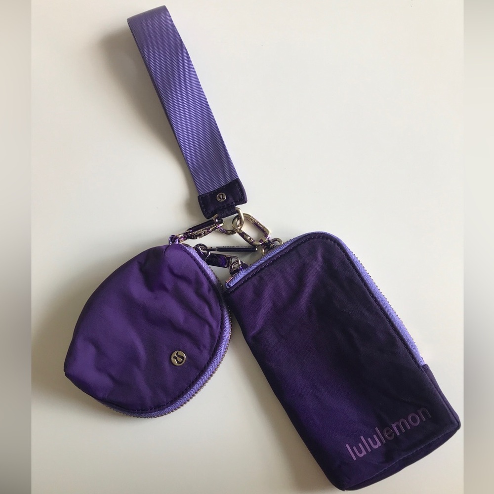 The LULULEMON Dual Pouch Wristlet in purple